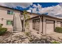 Exterior view of condo building with stairs and garage at 3507 59Th W Ave # 4020, Bradenton, FL 34210