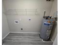 Laundry room with washer and dryer hookups and new flooring at 2416 E Emma St, Tampa, FL 33610