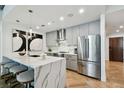 Modern kitchen with gray cabinetry and large island at 777 N Ashley Dr # 806, Tampa, FL 33602