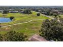 Aerial view of a park-like setting with a walking path at 2535 Lancaster Dr # 2535, Sun City Center, FL 33573