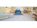 Bright living room with tile floors and comfortable seating at 2535 Lancaster Dr # 2535, Sun City Center, FL 33573