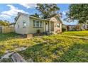 Light green house with updated windows and walkway at 3457 22Nd S Ave, St Petersburg, FL 33711