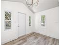 Inviting entryway with wood-look floors, recessed lighting, and a stylish chandelier at 6907 N 20Th St, Tampa, FL 33610