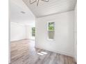 Bright living room featuring wood floors and recessed lighting at 6907 N 20Th St, Tampa, FL 33610