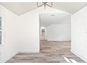 View from living room to bathroom shows nice floorplan with hardwood floors at 6907 N 20Th St, Tampa, FL 33610