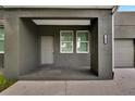 Gray house with covered porch, front door, and windows at 2604 N 29Th St, Tampa, FL 33605