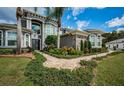 Elegant walkway leading to the entrance of the house at 180 Keystone Palms Blvd, Tarpon Springs, FL 34688