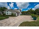 Large home with 3-car garage and paver driveway at 180 Keystone Palms Blvd, Tarpon Springs, FL 34688