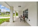 Inviting front porch with seating, perfect for relaxing and enjoying the outdoors at 2391 69Th S Ave, St Petersburg, FL 33712