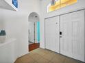 Bright and airy entryway with tile flooring and double doors at 1122 Vinetree Dr, Brandon, FL 33510