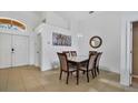 Dining room with a six-seat table and access to the living room at 1122 Vinetree Dr, Brandon, FL 33510