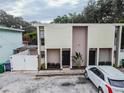 Aerial view of a multi-unit building with parking and trees at 1905 E Mulberry Dr # 2, Tampa, FL 33604