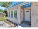 House exterior featuring a front entrance and landscaping at 1404 E Frances Ave, Plant City, FL 33563