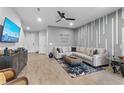 Spacious living room with a large sectional sofa and TV at 11826 Sky Acres Ter, Bradenton, FL 34211