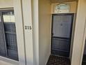 Condo entrance with address number and beach house decor at 6322 Palma Del Mar S Blvd # 215, St Petersburg, FL 33715