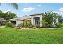 Single-story home with landscaped yard and attached garage at 289 Dandelion Ct, Spring Hill, FL 34606