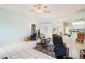 Spacious living room with tile floors and multiple seating areas at 289 Dandelion Ct, Spring Hill, FL 34606