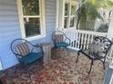 Inviting front porch with comfortable seating area, creating a cozy outdoor space at 860 19 N Ave, St Petersburg, FL 33704