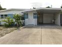 House exterior showcasing a carport and well-maintained landscaping at 5163 Tangelo Dr, New Port Richey, FL 34652