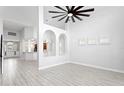 Bright living room with high ceilings and hardwood floors at 10616 Cape Hatteras Dr, Tampa, FL 33615
