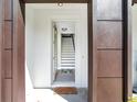 Bright entryway with stairs leading to the upper level at 156 175Th E Ave, Redington Shores, FL 33708