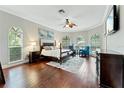 Large main bedroom with hardwood floors and ample natural light at 8945 Magnolia Chase Cir, Tampa, FL 33647