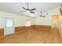 Spacious living room with hardwood floors and ceiling fans at 2804 Holloway Rd, Plant City, FL 33567