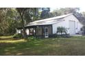 Home with screened porch and large barn at 2804 Holloway Rd, Plant City, FL 33567