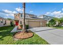 Two-story house with solar panels and a two-car garage at 20270 Merry Oak Ave, Tampa, FL 33647