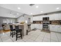 Spacious kitchen featuring stainless steel appliances and white cabinets at 9716 Fox Chapel Rd, Tampa, FL 33647