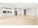 Open concept kitchen with island and stainless steel appliances at 23176 Pachino Way, Lutz, FL 33549