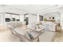 Open concept living room and kitchen with modern appliances at 23176 Pachino Way, Lutz, FL 33549