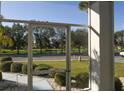 Enclosed patio with a view of the lake and road at 2451 E Del Webb Blvd, Sun City Center, FL 33573