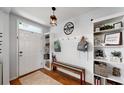 Bright entryway with built-in bench, shelves, and hooks at 2616 Garden Plum Pl, Odessa, FL 33556