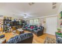 Spacious living room featuring a large sectional sofa and hardwood floors at 5104 S 66Th St, Tampa, FL 33619