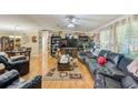 Open living room with hardwood floors and ample natural light at 5104 S 66Th St, Tampa, FL 33619