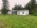 One-story home with a large yard needing landscaping at 1908 51St W Ave, Bradenton, FL 34207