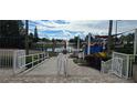 Community playground with a pond and sitting area at 11413 Captiva Kay Dr, Riverview, FL 33569