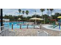 Community pool with a kiddie pool and shaded seating at 11413 Captiva Kay Dr, Riverview, FL 33569