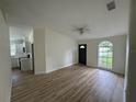 Bright living room with laminate floors and kitchen view at 8518 N Edison Ave, Tampa, FL 33604