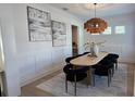 Bright dining room featuring decorative light fixture and modern decor for an inviting space at 559 W Davis Blvd, Tampa, FL 33606