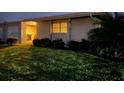 House exterior at night with well-maintained lawn at 3280 Southfield Ln # 804, Sarasota, FL 34239
