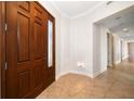 Bright foyer with tile floors and access to other rooms at 1030 Bellasol Way # 201, Apollo Beach, FL 33572