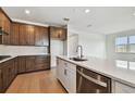 Spacious kitchen with an island, stainless steel appliances, and modern fixtures at 13715 Brookside Haven St, Riverview, FL 33578