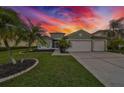Beautiful house exterior at sunset, showcasing curb appeal at 10926 Sailbrooke Dr, Riverview, FL 33579