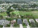 Community overview showcasing homes, landscaping, and golf course at 10926 Sailbrooke Dr, Riverview, FL 33579