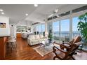 Bright living room with water views and hardwood floors at 5153 Isla Key S Blvd # 412, St Petersburg, FL 33715