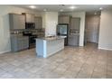 Kitchen with island, stainless steel appliances, granite countertops at 9143 Hillcroft Dr, Riverview, FL 33578