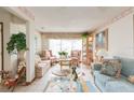Bright living room with floral sofas and a coffee table at 6515 Los Altos Way, Tampa, FL 33634