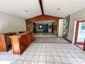 Large living room with high ceilings and a bar area, currently under renovation at 17025 Dalberg Dr, Spring Hill, FL 34610